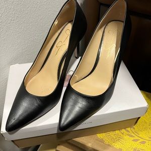 Lightly worn classic black pumps